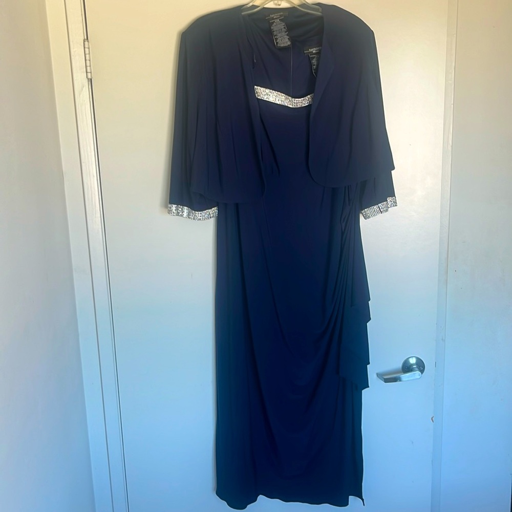 Dress by the brand R&M Richard’s color: navy blue